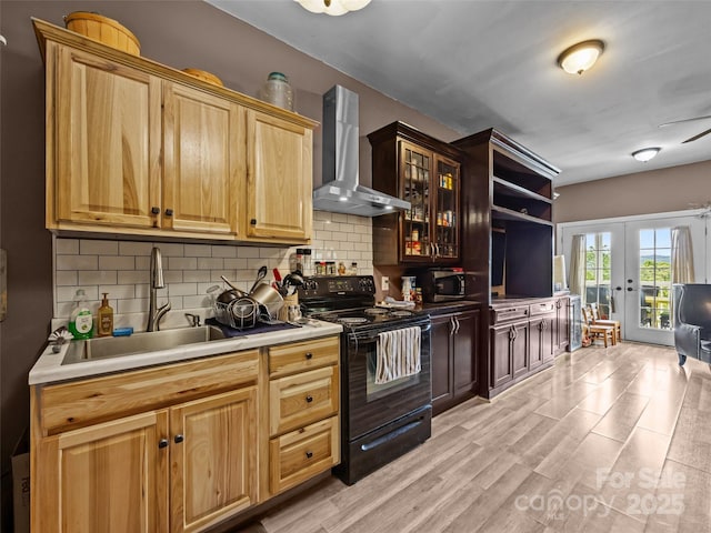 kitchen with wall chimney range hood, french doors, black electric range oven, and tasteful backsplash