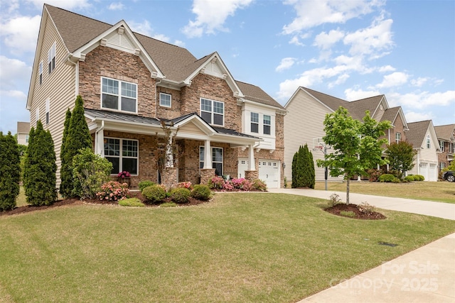 craftsman house featuring covered porch, driveway, a front lawn, an attached garage, and stone siding