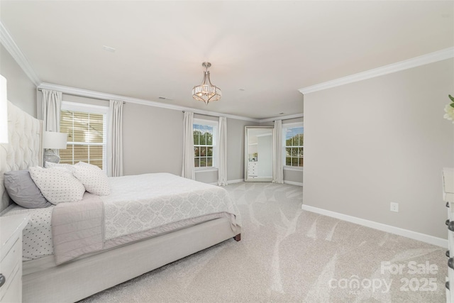 bedroom featuring baseboards, ornamental molding, light carpet, and a notable chandelier