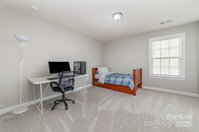 carpeted bedroom featuring baseboards and visible vents