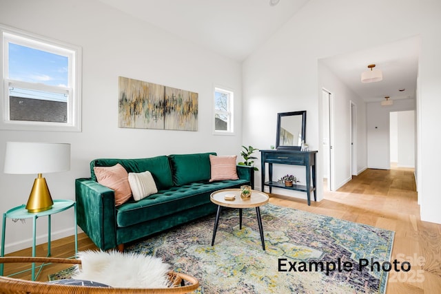 4 Chestnut Ridge Ave, Asheville, NC 28804 - living room featuring baseboards, wood finished floors, and lofted ceiling