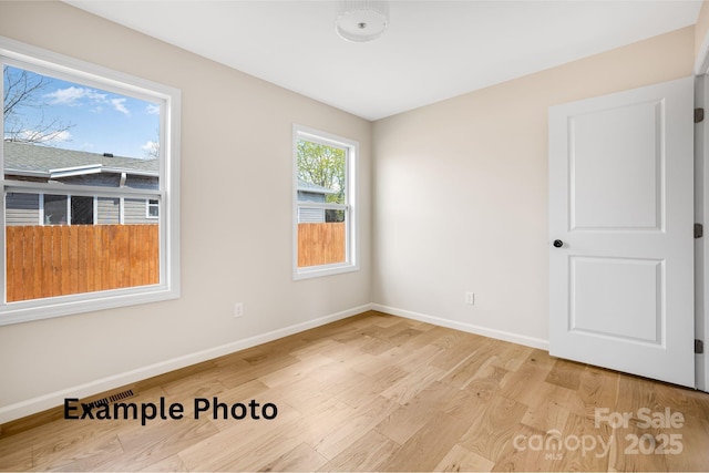 4 Chestnut Ridge Ave, Asheville, NC 28804 - spare room with baseboards and light wood-style floors