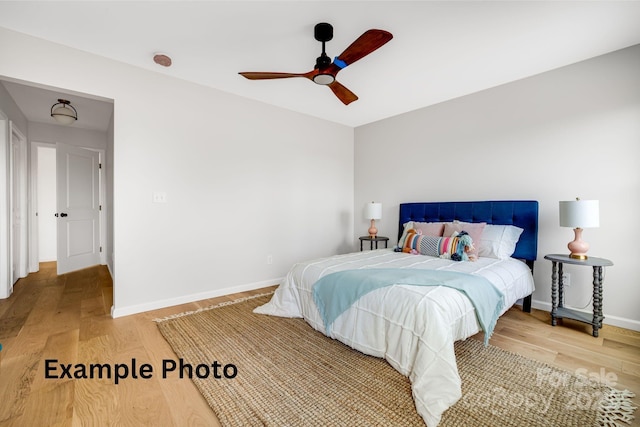 4 Chestnut Ridge Ave, Asheville, NC 28804 - bedroom with a ceiling fan, baseboards, and light wood-style flooring