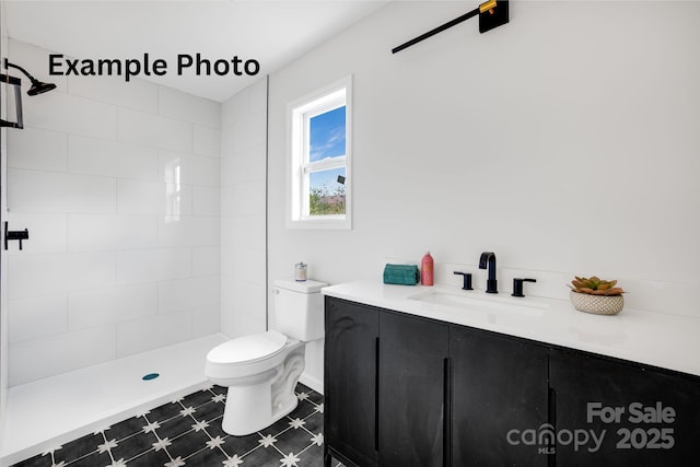 4 Chestnut Ridge Ave, Asheville, NC 28804 - full bath with vanity, tile patterned floors, toilet, and tiled shower