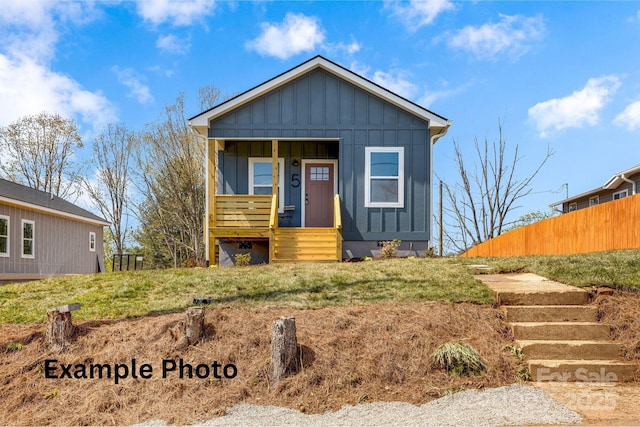 4 Chestnut Ridge Ave, Asheville, NC 28804 - bungalow-style house featuring stairs, board and batten siding, fence, and covered porch