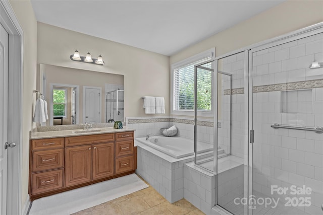 bathroom with vanity, a shower stall, tile patterned floors, and a bath