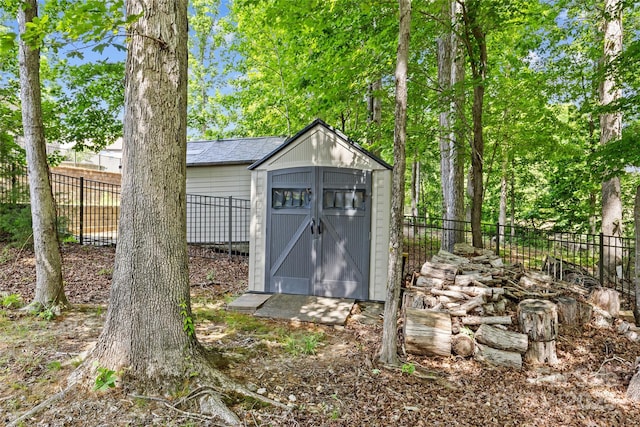 view of shed with a fenced backyard