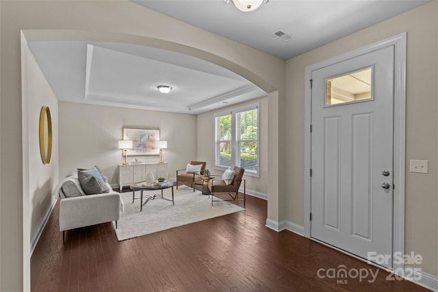 907 Lingfield Ln, Waxhaw, NC 28173 - entryway with arched walkways, dark wood-style flooring, and a tray ceiling