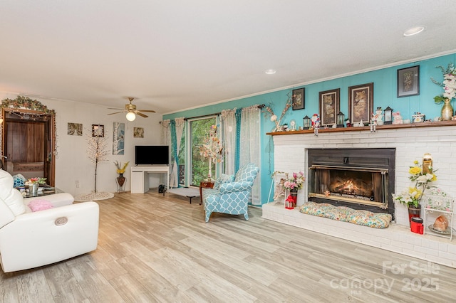 6804 Lineberger Rd, Denver, NC 28037 - living area with a fireplace, wood finished floors, crown molding, ceiling fan, and recessed lighting