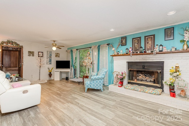 6804 Lineberger Rd, Denver, NC 28037 - living area featuring crown molding, wood finished floors, a brick fireplace, ceiling fan, and recessed lighting