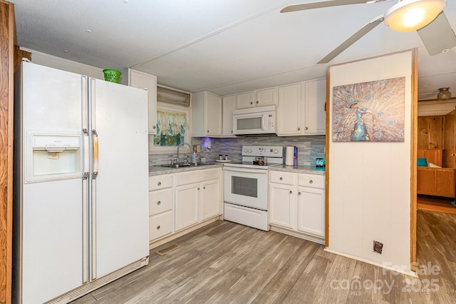 6804 Lineberger Rd, Denver, NC 28037 - kitchen with white appliances, a sink, light wood-style flooring, and light countertops
