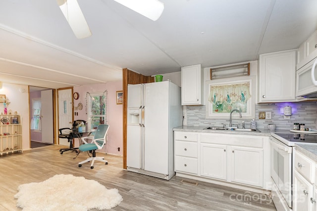6804 Lineberger Rd, Denver, NC 28037 - kitchen featuring white appliances, a sink, backsplash, and white cabinetry