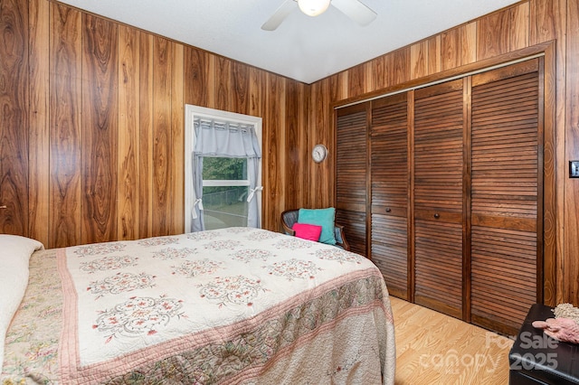6804 Lineberger Rd, Denver, NC 28037 - bedroom with a closet, wooden walls, and a ceiling fan