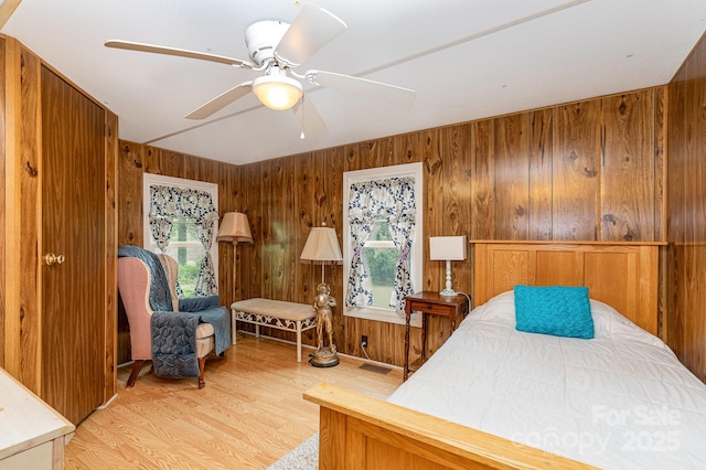 6804 Lineberger Rd, Denver, NC 28037 - bedroom with wooden walls, wood finished floors, and a ceiling fan