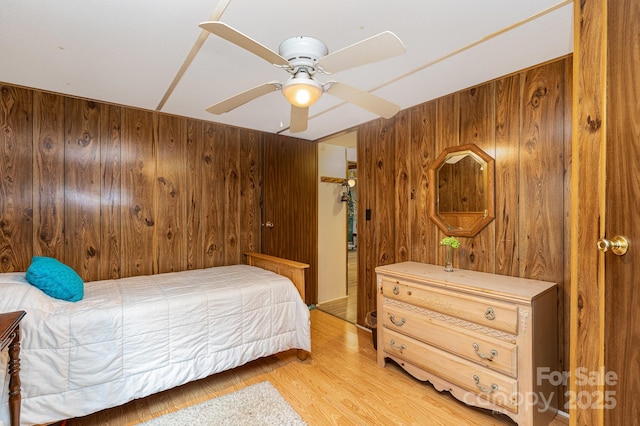 6804 Lineberger Rd, Denver, NC 28037 - bedroom featuring wooden walls, light wood-type flooring, and ceiling fan