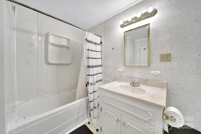 bathroom featuring shower / bath combo with shower curtain, ornamental molding, and vanity