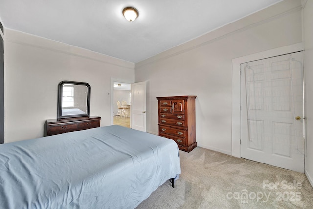 carpeted bedroom featuring baseboards