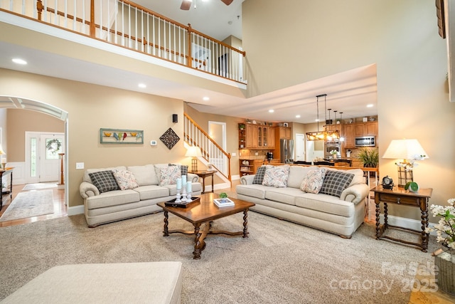7730 Windsor Forest Pl, Harrisburg, NC 28075 - living room with baseboards, light carpet, recessed lighting, and a high ceiling