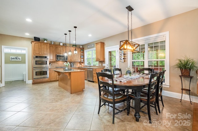 7730 Windsor Forest Pl, Harrisburg, NC 28075 - dining area featuring baseboards, light tile patterned floors, and recessed lighting
