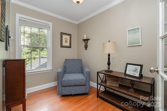 7730 Windsor Forest Pl, Harrisburg, NC 28075 - living area featuring ornamental molding, light wood-style flooring, and baseboards