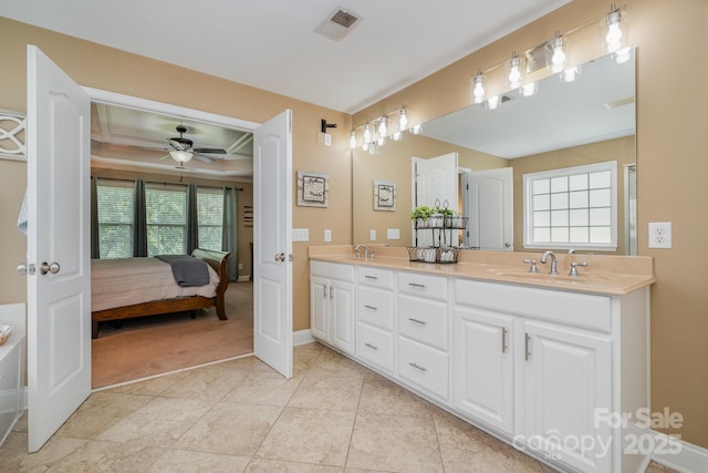 7730 Windsor Forest Pl, Harrisburg, NC 28075 - ensuite bathroom featuring a ceiling fan, visible vents, double vanity, and a sink