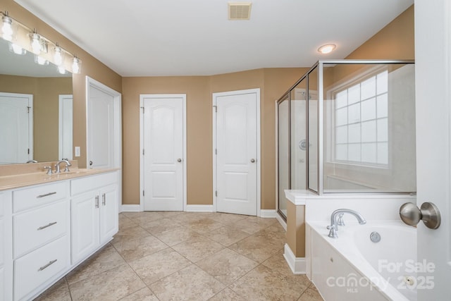 7730 Windsor Forest Pl, Harrisburg, NC 28075 - full bath featuring vanity, visible vents, a stall shower, baseboards, and a bath