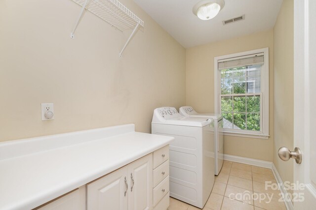 7730 Windsor Forest Pl, Harrisburg, NC 28075 - laundry room with cabinet space, visible vents, light tile patterned floors, washing machine and dryer, and baseboards