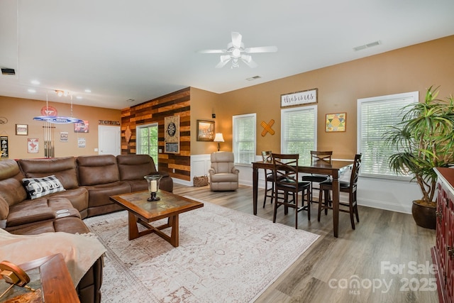 7730 Windsor Forest Pl, Harrisburg, NC 28075 - living room featuring plenty of natural light, visible vents, wood finished floors, and ceiling fan