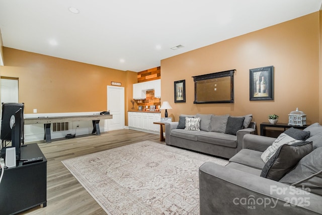 7730 Windsor Forest Pl, Harrisburg, NC 28075 - living room with visible vents, light wood-style flooring, baseboards, and recessed lighting
