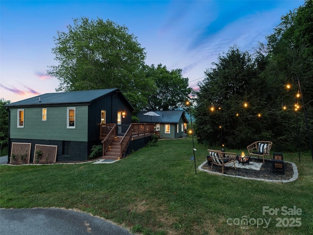 68 Piney Mountain Church Rd, Candler, NC 28715 - view of yard featuring stairway, a fire pit, and a wooden deck