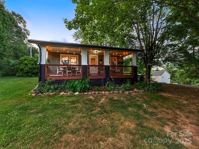 68 Piney Mountain Church Rd, Candler, NC 28715 - view of front facade with a porch and a front yard
