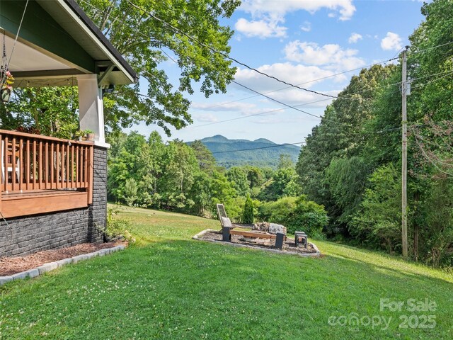 68 Piney Mountain Church Rd, Candler, NC 28715 - view of yard with a forest view, a mountain view, and an outdoor fire pit