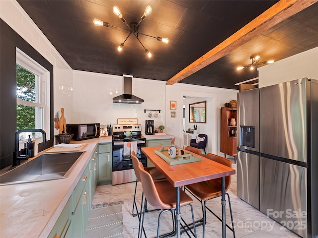 68 Piney Mountain Church Rd, Candler, NC 28715 - kitchen featuring wall chimney range hood, green cabinetry, a sink, marble finish floor, and stainless steel appliances