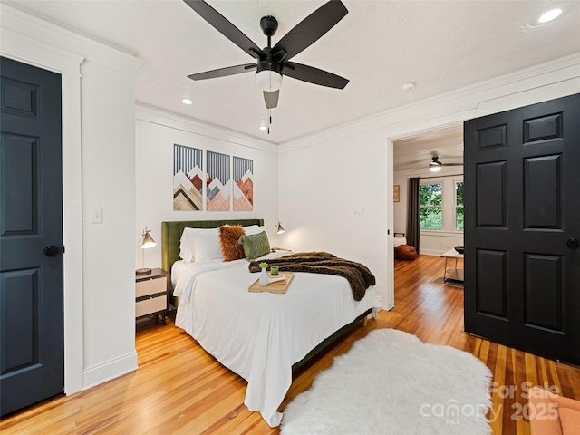 68 Piney Mountain Church Rd, Candler, NC 28715 - bedroom with crown molding, light wood-style floors, baseboards, ceiling fan, and recessed lighting