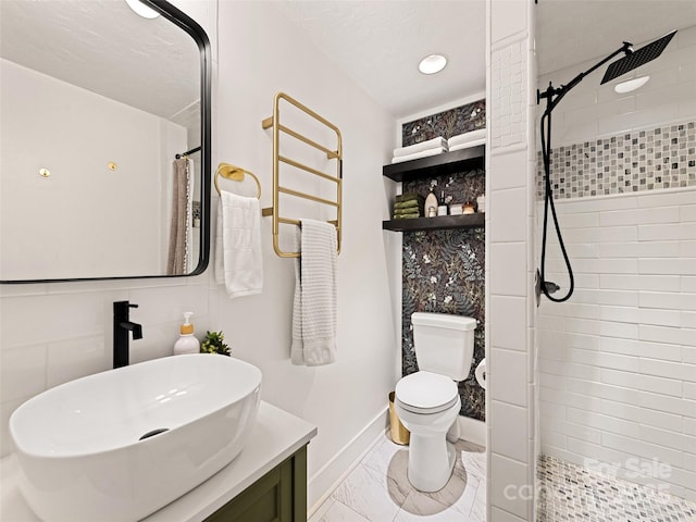 68 Piney Mountain Church Rd, Candler, NC 28715 - full bathroom featuring vanity, toilet, marble finish floor, baseboards, and tiled shower