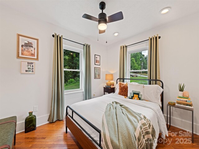 68 Piney Mountain Church Rd, Candler, NC 28715 - bedroom with baseboards, ceiling fan, and wood finished floors