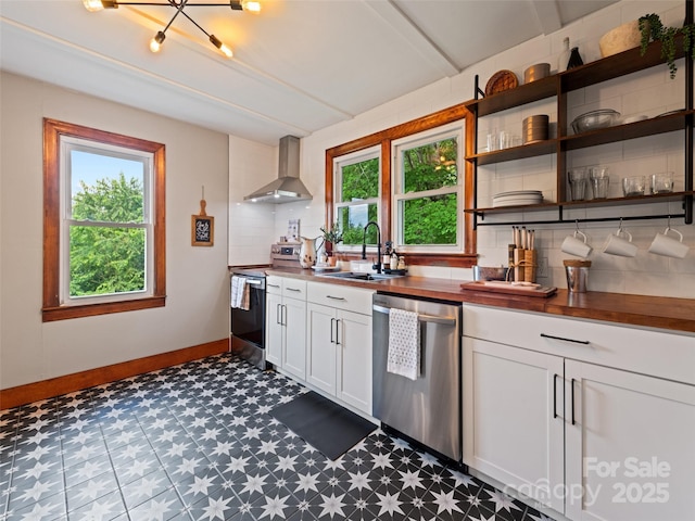 68 Piney Mountain Church Rd, Candler, NC 28715 - kitchen featuring wall chimney range hood, dark floors, wood counters, stainless steel appliances, and backsplash