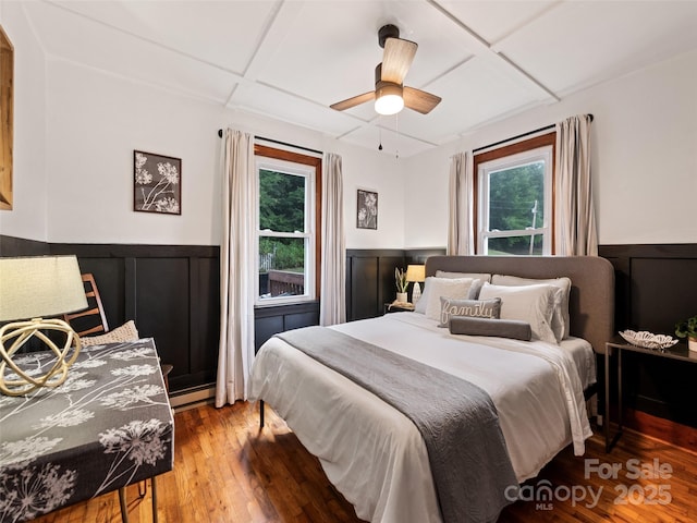 68 Piney Mountain Church Rd, Candler, NC 28715 - bedroom featuring wainscoting, wood finished floors, and multiple windows