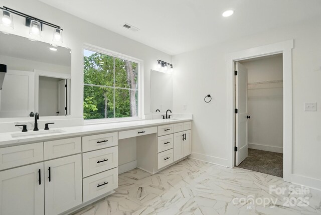 full bathroom with visible vents, a sink, double vanity, and recessed lighting