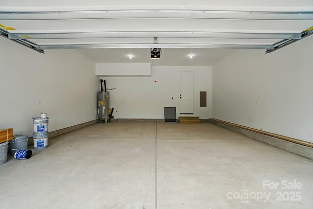 garage featuring electric panel, a garage door opener, and gas water heater