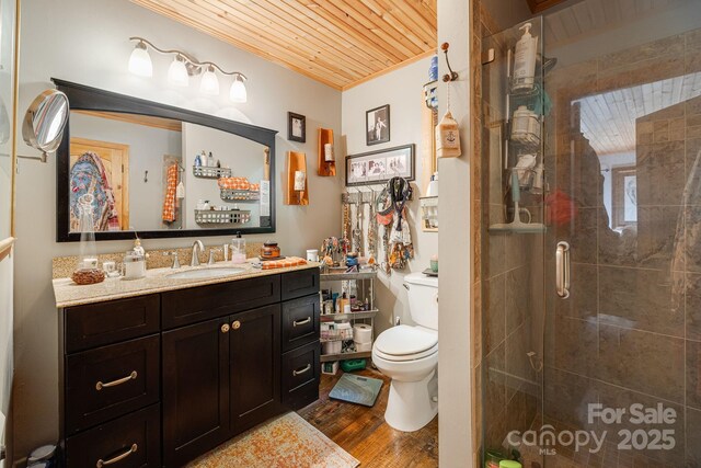197 Gardenside Rd, Mars Hill, NC 28754 - bathroom with crown molding, a stall shower, toilet, and wood finished floors