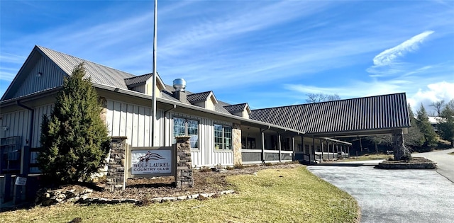 197 Gardenside Rd, Mars Hill, NC 28754 - view of property exterior with board and batten siding, metal roof, and stone siding