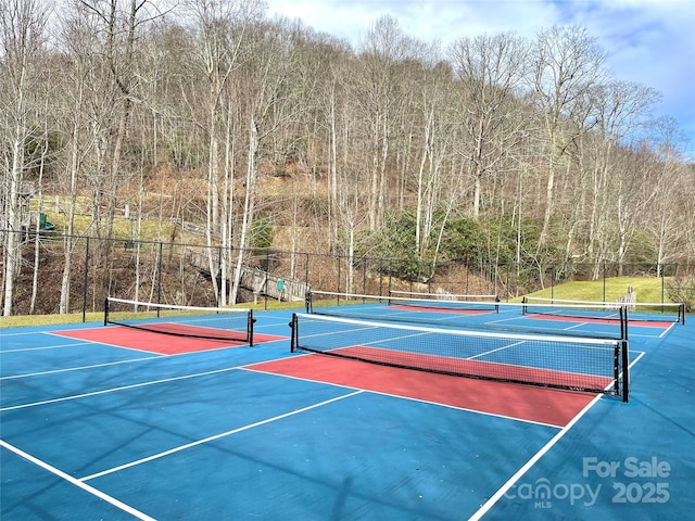 197 Gardenside Rd, Mars Hill, NC 28754 - view of sport court with fence, community basketball court, and a wooded view