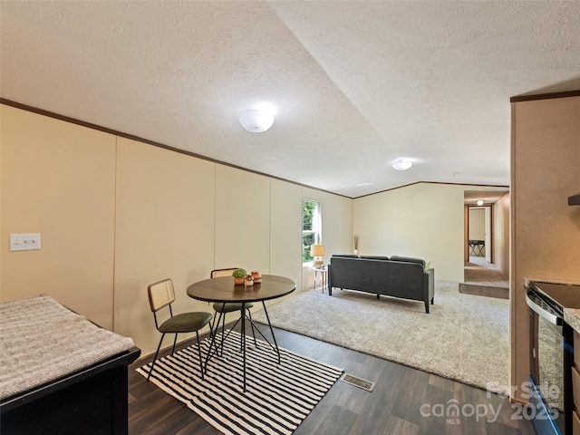 700 Cove Creek Rd, Waynesville, NC 28785 - living room featuring crown molding, a textured ceiling, and wood finished floors