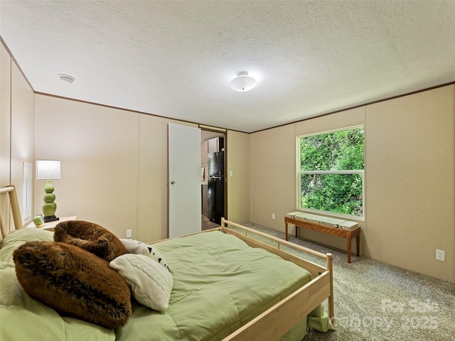 700 Cove Creek Rd, Waynesville, NC 28785 - bedroom with carpet flooring, a textured ceiling, and freestanding refrigerator