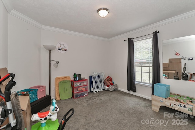 recreation room featuring baseboards, ornamental molding, and carpet