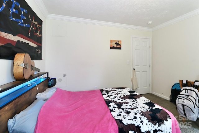 bedroom with carpet floors, baseboards, and ornamental molding