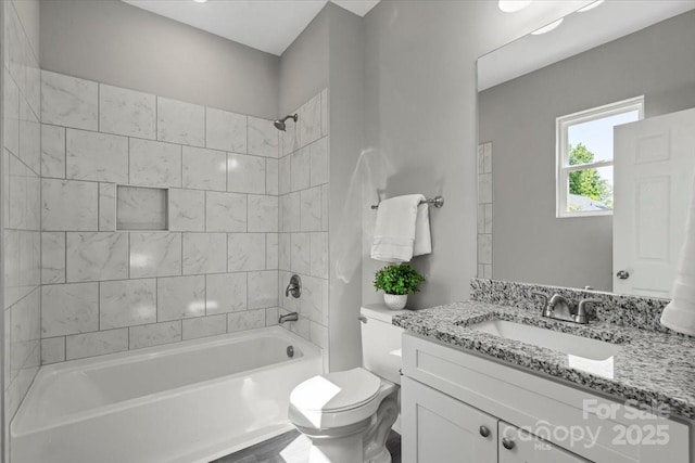 full bath featuring toilet, shower / washtub combination, and vanity