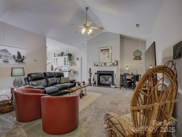 433 Linsbury Ct, Gastonia, NC 28056 - carpeted living room featuring a glass covered fireplace, ceiling fan, visible vents, and lofted ceiling