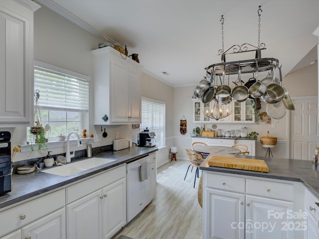 433 Linsbury Ct, Gastonia, NC 28056 - kitchen with dark countertops, white dishwasher, white cabinetry, a chandelier, and a sink